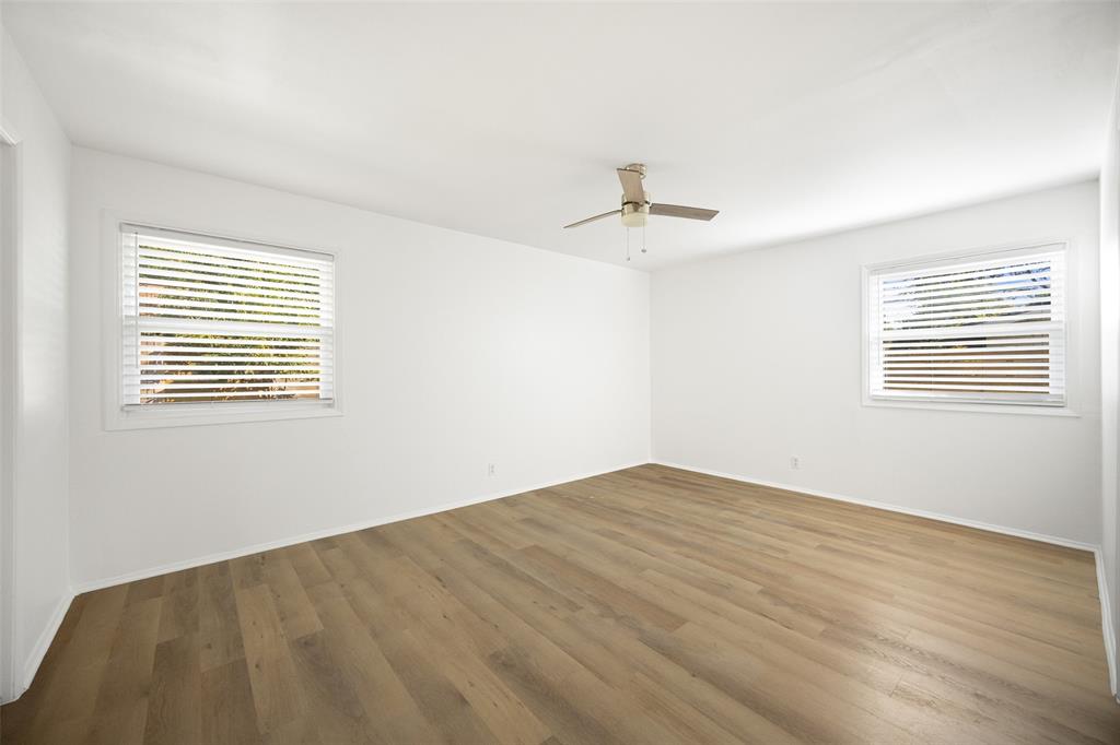 812 Sherbrook Drive Richardson, TX 75080 - Photo 14 of 28 a view of an empty room with a window