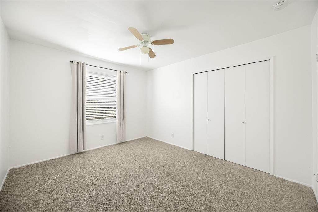 812 Sherbrook Drive Richardson, TX 75080 - Photo 18 of 28 an empty room with windows and closet