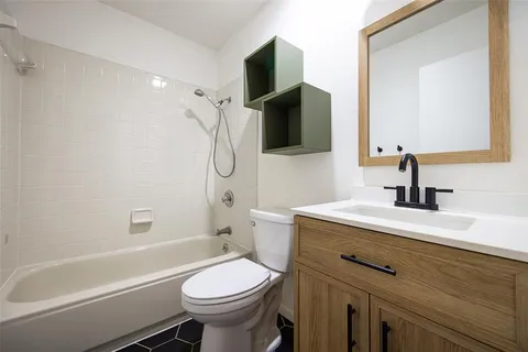 a view of an empty room with a cabinet