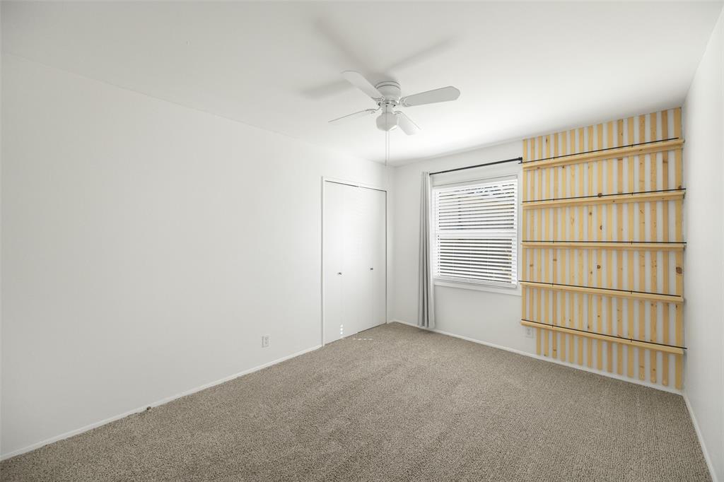 812 Sherbrook Drive Richardson, TX 75080 - Photo 20 of 28 a view of an empty room with a cabinet