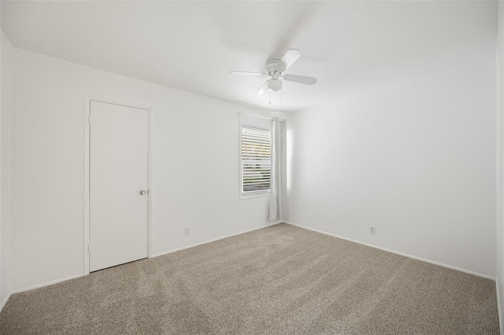 812 Sherbrook Drive Richardson, TX 75080 - Photo 21 of 28 a view of an empty room with a window