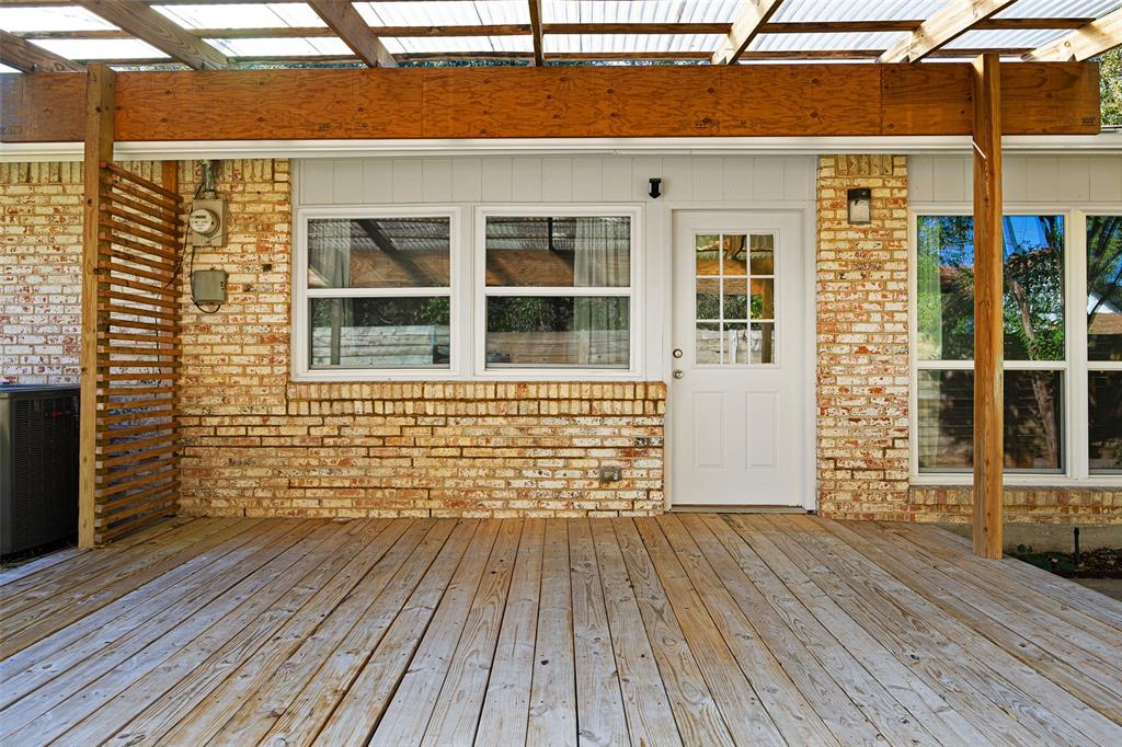 812 Sherbrook Drive Richardson, TX 75080 - Photo 25 of 28 a view of a brick house with wooden floor