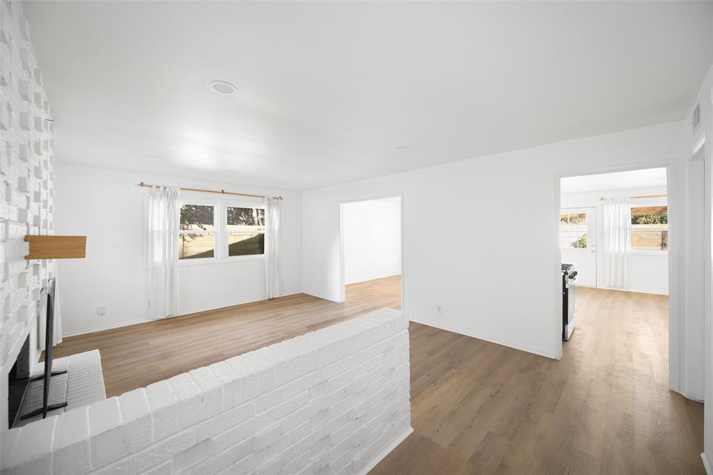 812 Sherbrook Drive Richardson, TX 75080 - Photo 6 of 28 a view of empty room with wooden floor