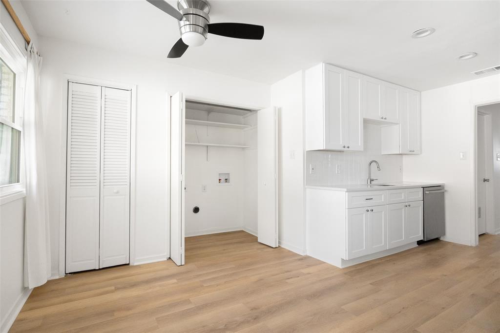 812 Sherbrook Drive Richardson, TX 75080 - Photo 9 of 28 a view of an empty room with window and cabinet