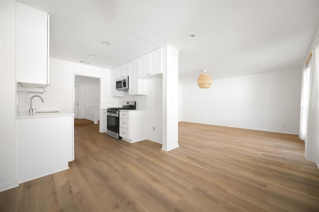 812 Sherbrook Drive Richardson, TX 75080 - Photo 10 of 28 a view of a kitchen with a sink dishwasher oven and cabinets