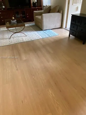 a kitchen with a refrigerator a stove top oven a sink and dishwasher