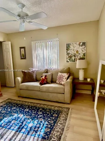 a bathroom with a granite countertop shower and a toilet