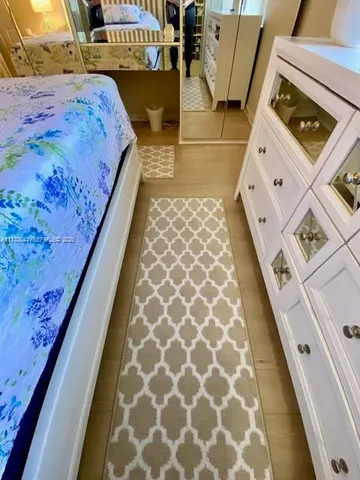 a view of large trees with a big yard