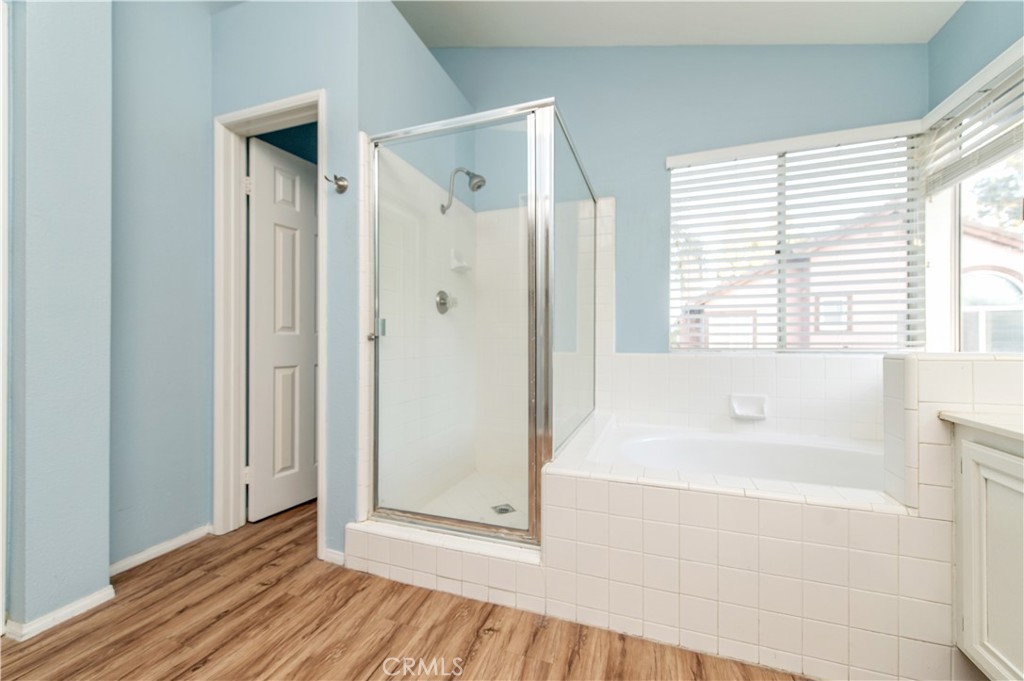 6771 Galveston Place Rancho Cucamonga, CA 91701 - Photo 27 of 38 a bathroom with a bathtub and a shower
