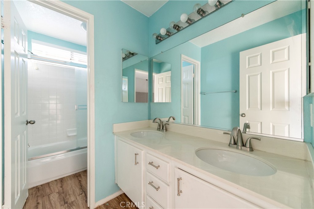 6771 Galveston Place Rancho Cucamonga, CA 91701 - Photo 28 of 38 a bathroom with a granite countertop sink and a mirror