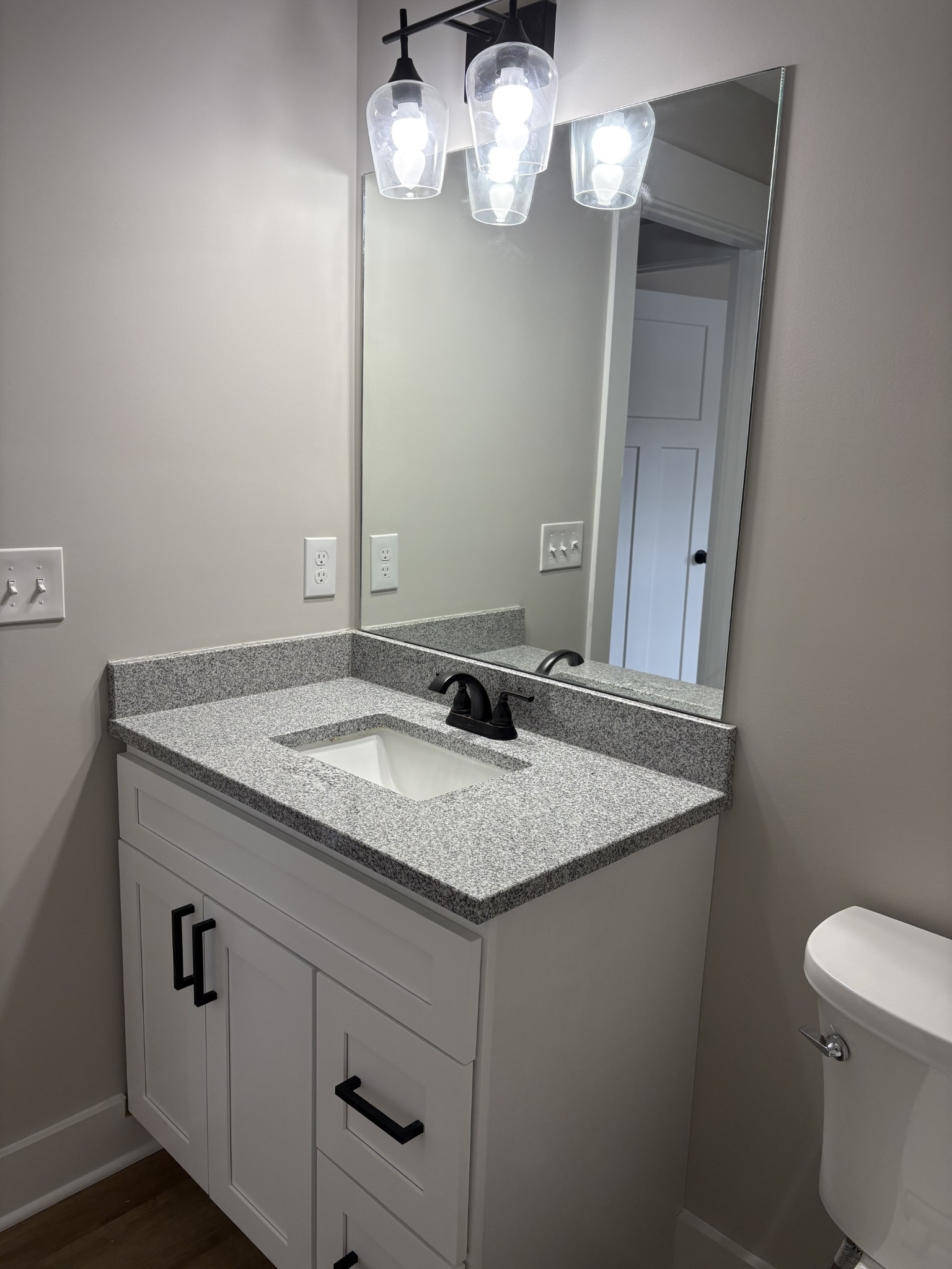2264 Collier Road Cornersville, TN 37047 - Photo 17 of 20 a bathroom with a granite countertop sink and a mirror