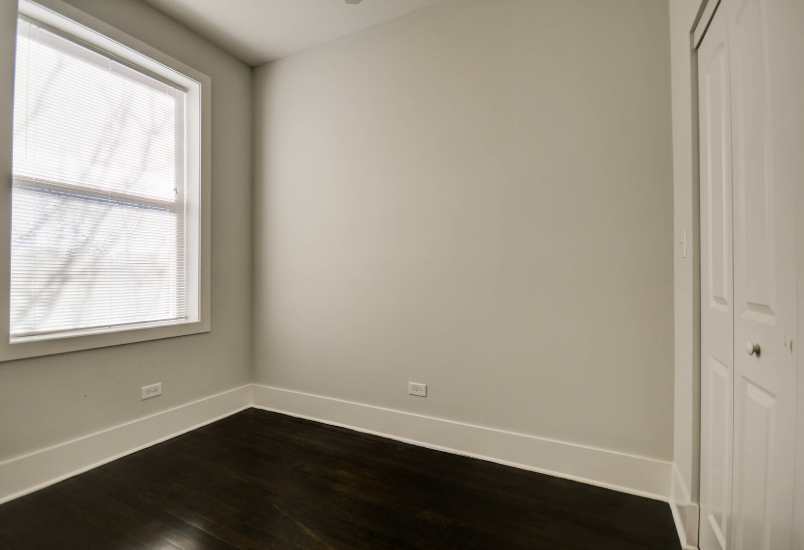 1724 West 21st Street, Unit 3F Chicago, IL 60608 - Photo 12 of 13 an empty room with wooden floor and windows