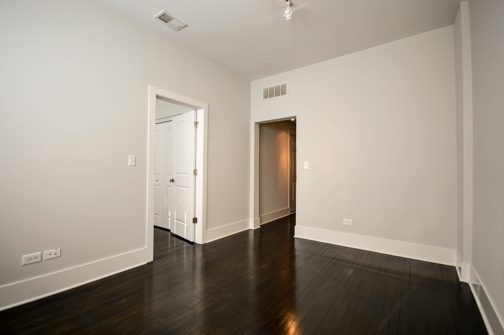 1724 West 21st Street, Unit 3F Chicago, IL 60608 - Photo 6 of 13 an empty room with wooden floor