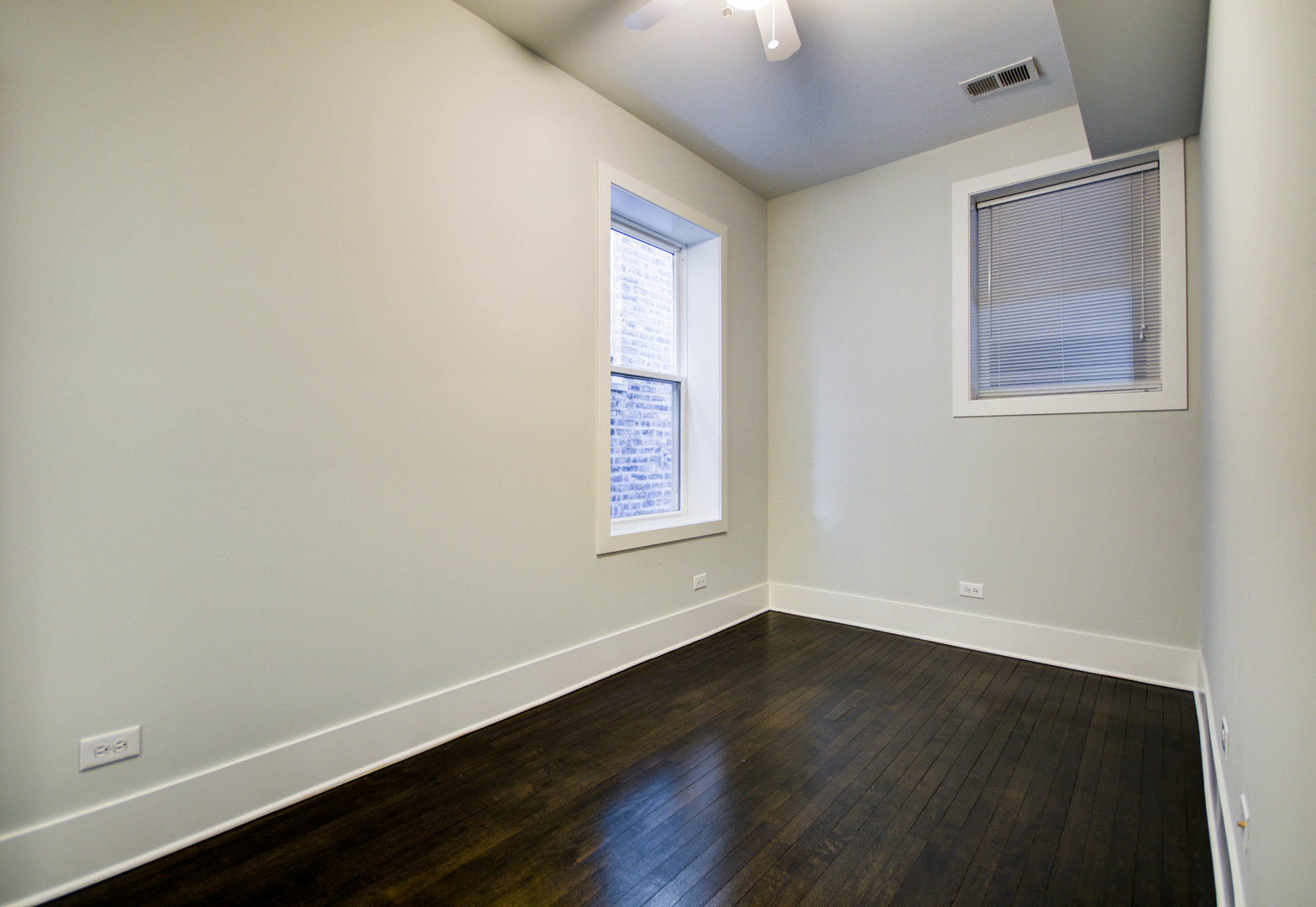 1724 West 21st Street, Unit 3F Chicago, IL 60608 - Photo 7 of 13 an empty room with wooden floor and windows