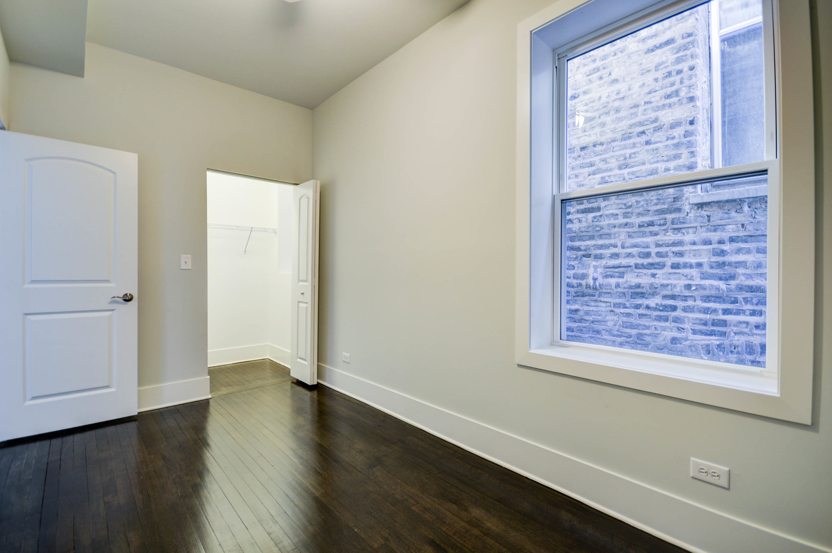 1724 West 21st Street, Unit 3F Chicago, IL 60608 - Photo 8 of 13 a view of an empty room with wooden floor and a window