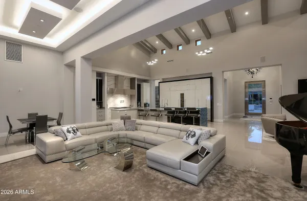 a living room with furniture and a large window