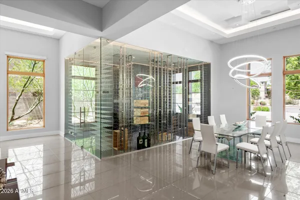 a view of a dining room with furniture and chandelier