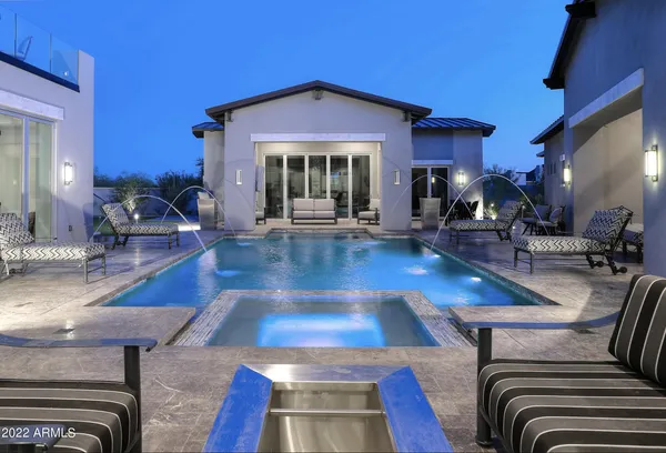 a view of a livingroom with furniture a table and chairs
