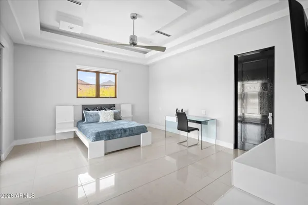 a kitchen with a sink a microwave and chairs