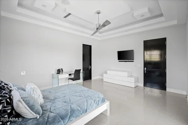 a kitchen with a sink a refrigerator and cabinets