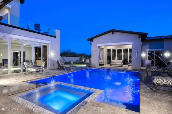 a view of swimming pool with chairs