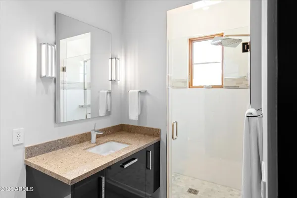 a kitchen with a sink dishwasher a stove and a refrigerator with wooden floor