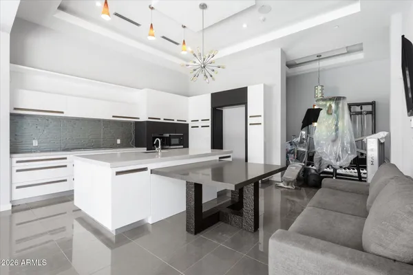 an aerial view of a house with garden space and street view