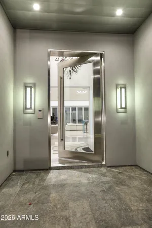 a view of a room with an empty space and windows