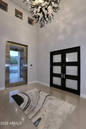 a view of a livingroom with furniture and natural light