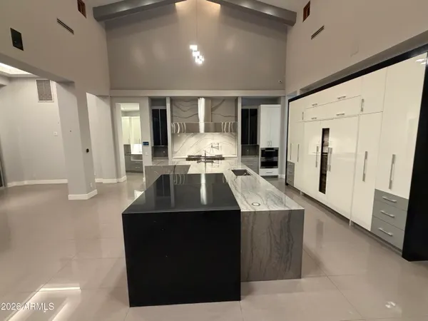 a kitchen with a sink a stove and refrigerator