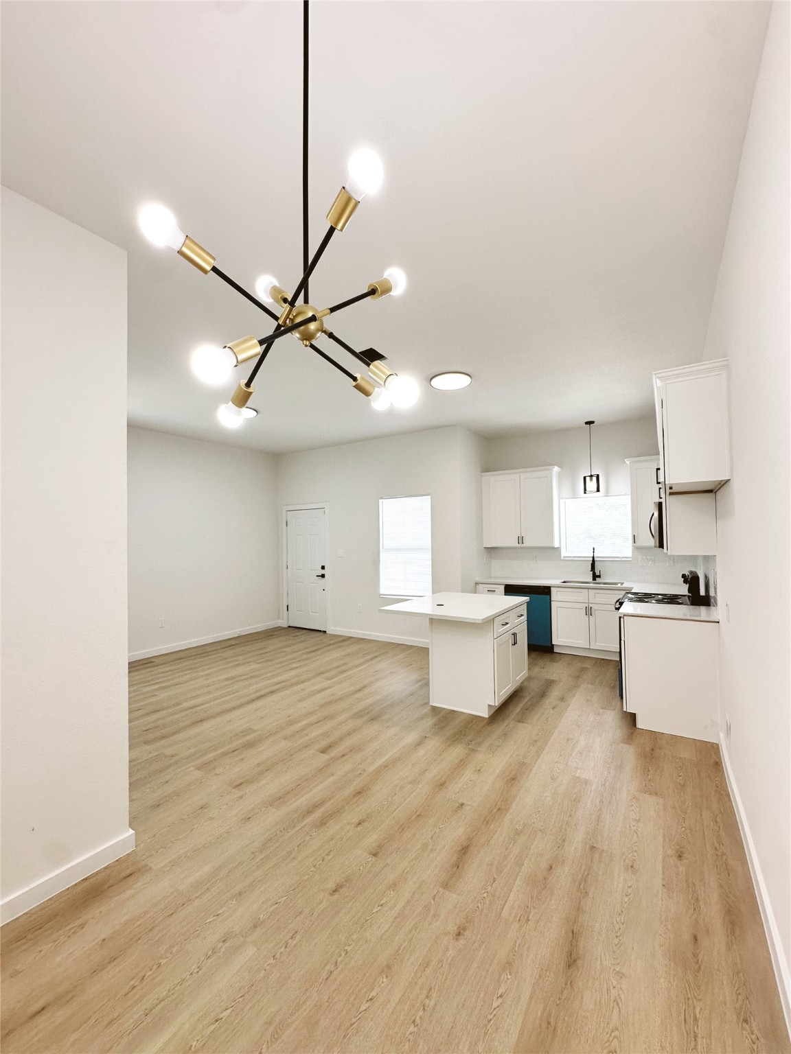 9709 Cargill Street Houston, TX 77029 - Photo 21 of 22 a view of kitchen and dining room with wooden floor