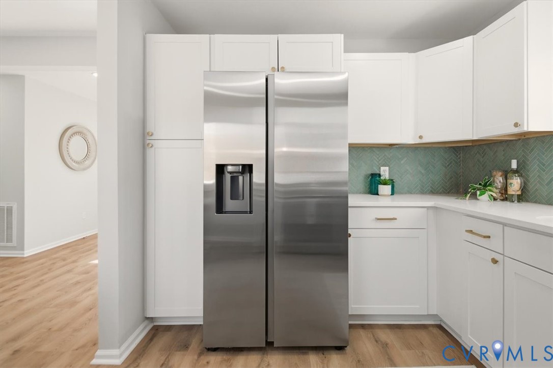 5712 Retriever Road Richmond, VA 23237 - Photo 18 of 40 Kitchen featuring stainless steel fridge, white ca