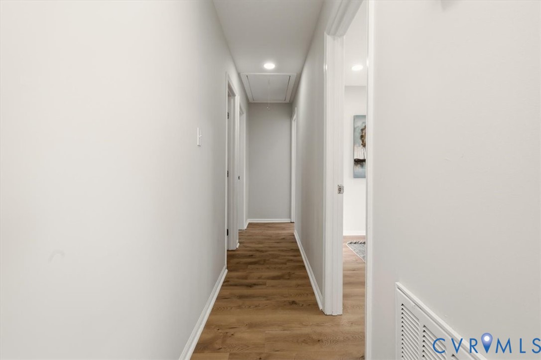 5712 Retriever Road Richmond, VA 23237 - Photo 21 of 40 Corridor with attic access, light wood-style floor
