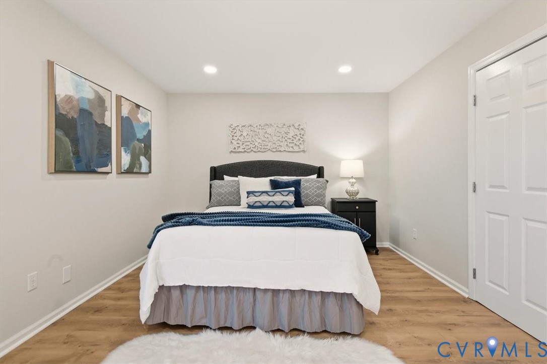 5712 Retriever Road Richmond, VA 23237 - Photo 29 of 40 Bedroom with wood finished floors and recessed lig