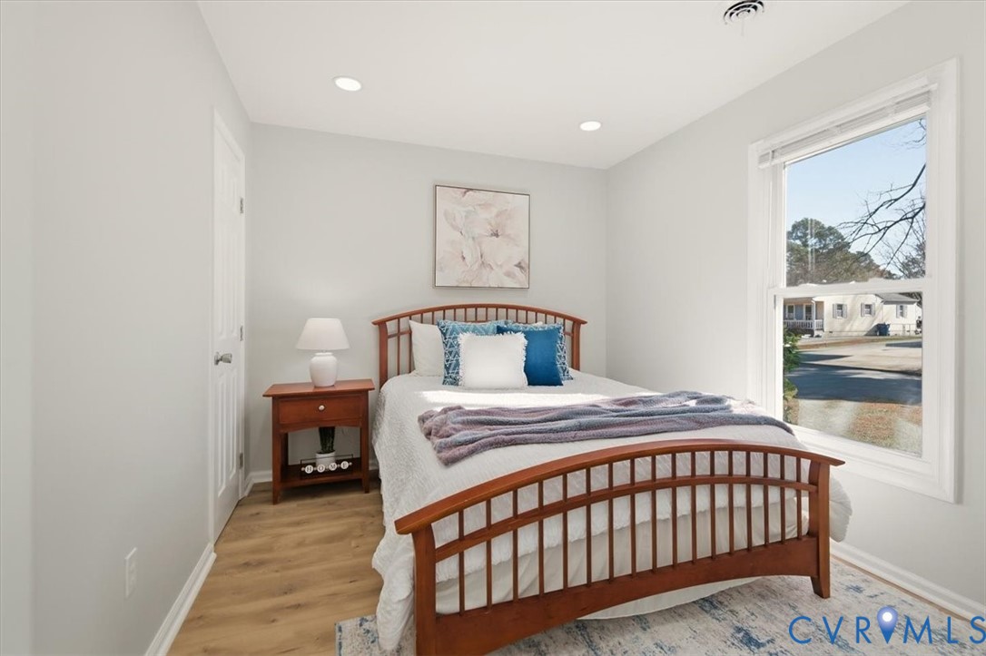 5712 Retriever Road Richmond, VA 23237 - Photo 32 of 40 Bedroom featuring light wood-style floors and rece