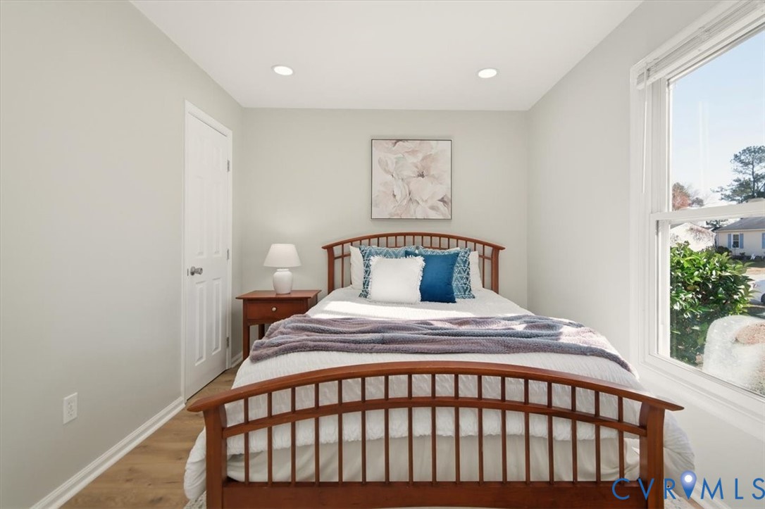 5712 Retriever Road Richmond, VA 23237 - Photo 33 of 40 Bedroom featuring wood finished floors and recesse