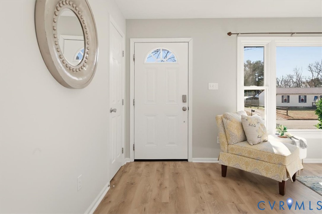 5712 Retriever Road Richmond, VA 23237 - Photo 7 of 40 Foyer entrance featuring wood finished floors and