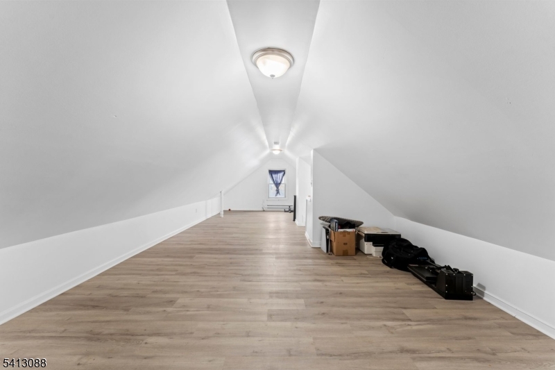907 Flora Street Elizabeth, NJ 07201 - Photo 11 of 24 a view of entryway and hall with wooden floor