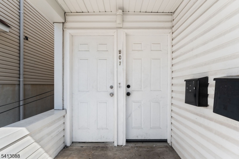 907 Flora Street Elizabeth, NJ 07201 - Photo 2 of 24 a view of a walk in closet