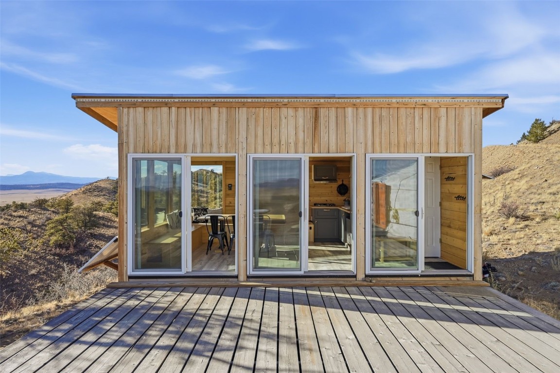 3490 Clear Creek Road Hartsel, CO 80449 - Photo 4 of 39 front view of a house with a balcony