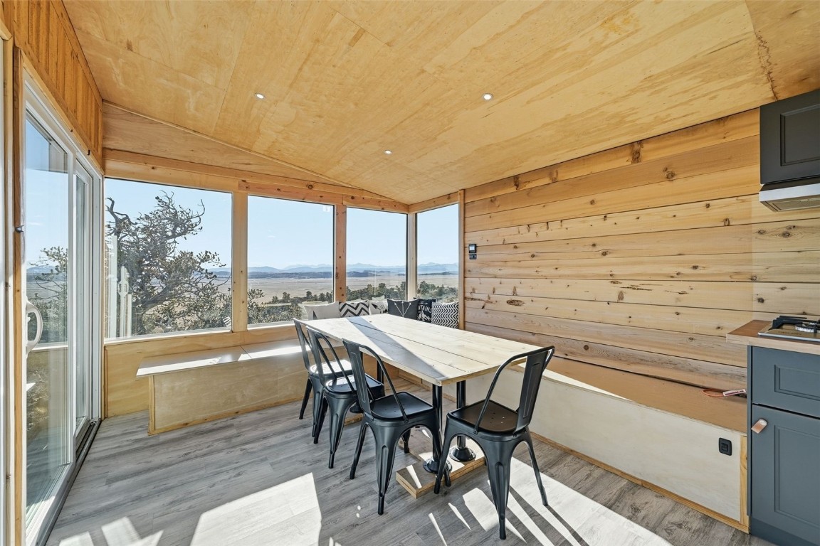 3490 Clear Creek Road Hartsel, CO 80449 - Photo 5 of 39 a dining room with furniture and wooden floor