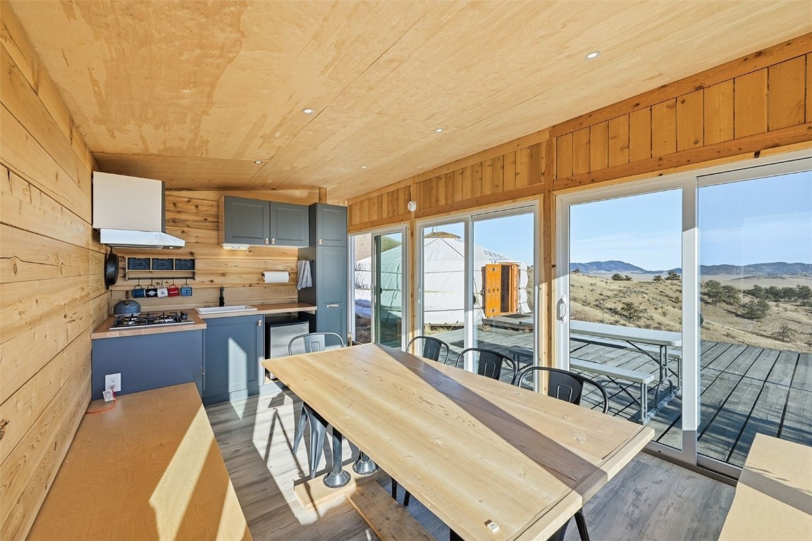 3490 Clear Creek Road Hartsel, CO 80449 - Photo 7 of 39 a living room with stainless steel appliances furniture a rug kitchen view and a large window