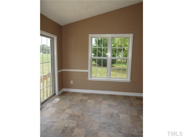 360 Gay Road Zebulon, NC 27597 - Photo 4 of 10 a view of an empty room with a window