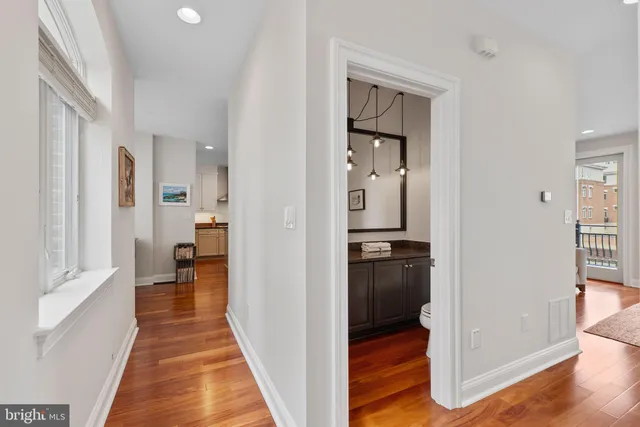 a bedroom with a large bed and a tv