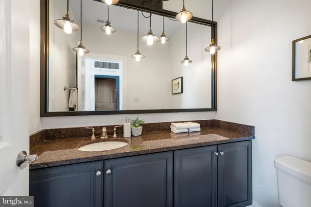 a bedroom with a bed and a fireplace