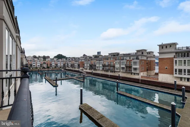 a bedroom with a bed and glass door