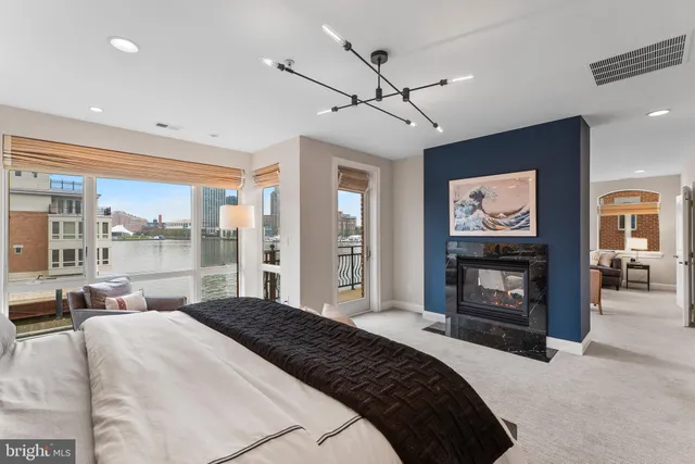 a bathroom with a sink vanity granite toilet and a mirror