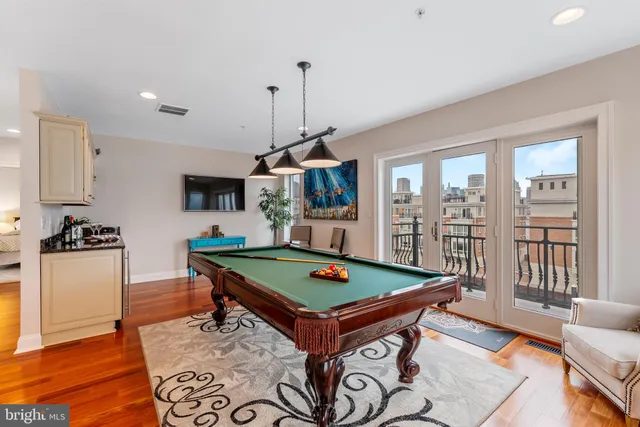 a kitchen with a sink and a stove top oven