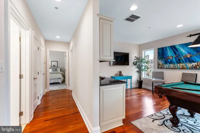 a backyard of a house with barbeque oven table and chairs