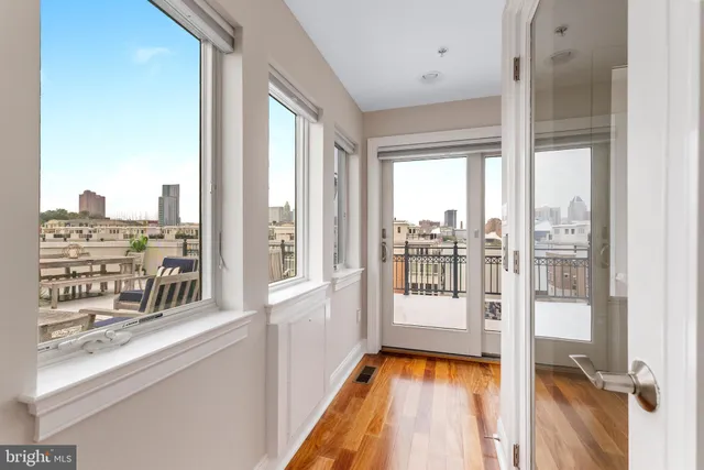 a view of water with boats and trees in the background